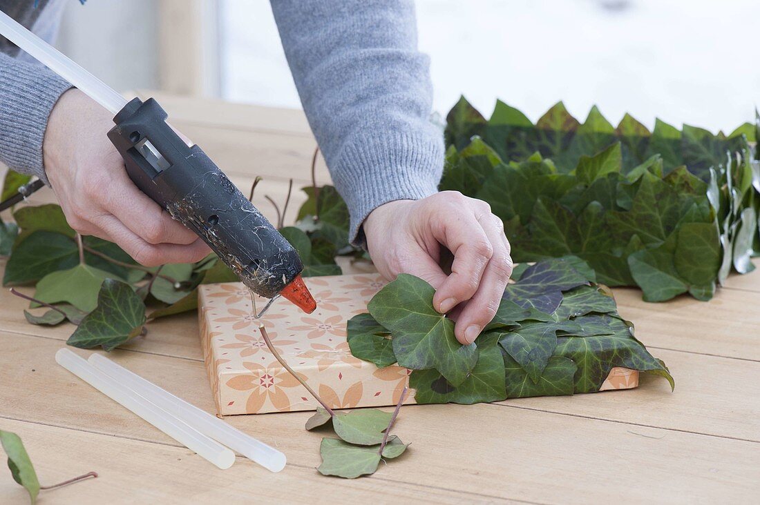 Gift box stuck with ivy leaves