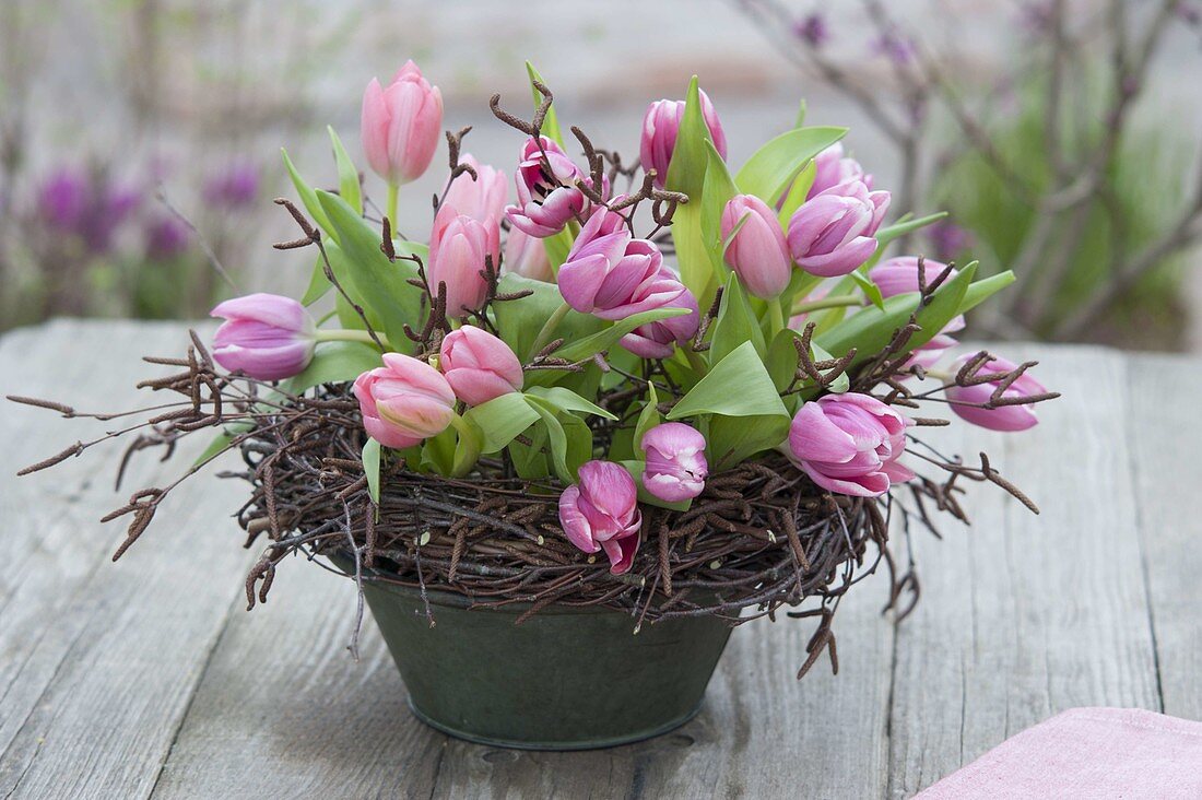 Tulips arrangement in wreath of birch vines