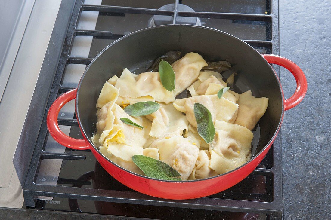 Homemade pumpkin ravioli made from Hokkaido pumpkin with sage