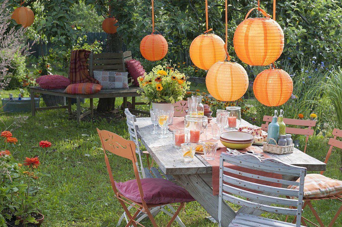 Garden party with orange lanterns as decoration