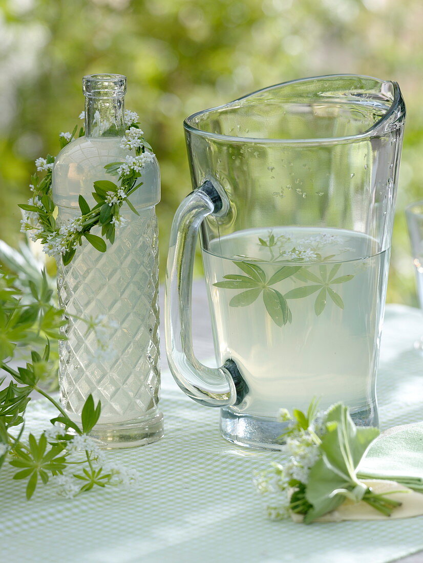 Lemonade with woodruff and wreath around bottle neck