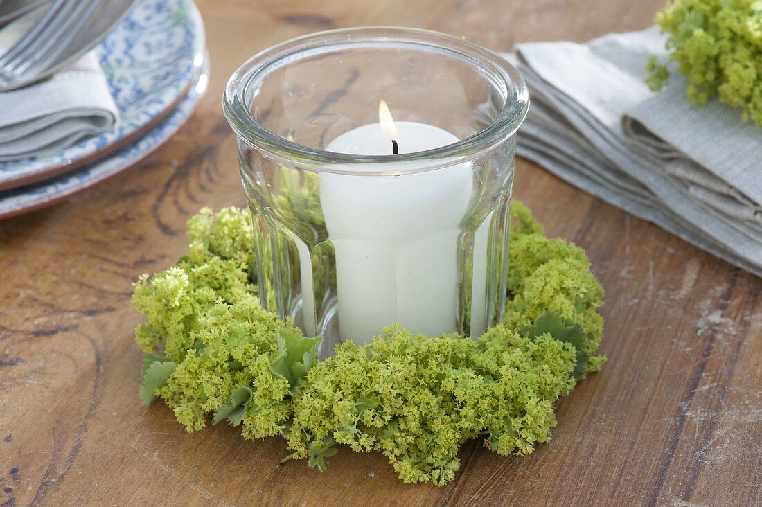 Lantern with Alchemilla (lady's mantle) flowers wreath