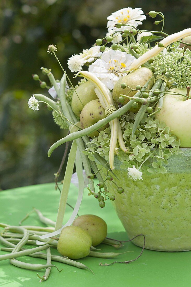 White-green bouquet with summer flowers, fruits and vegetables