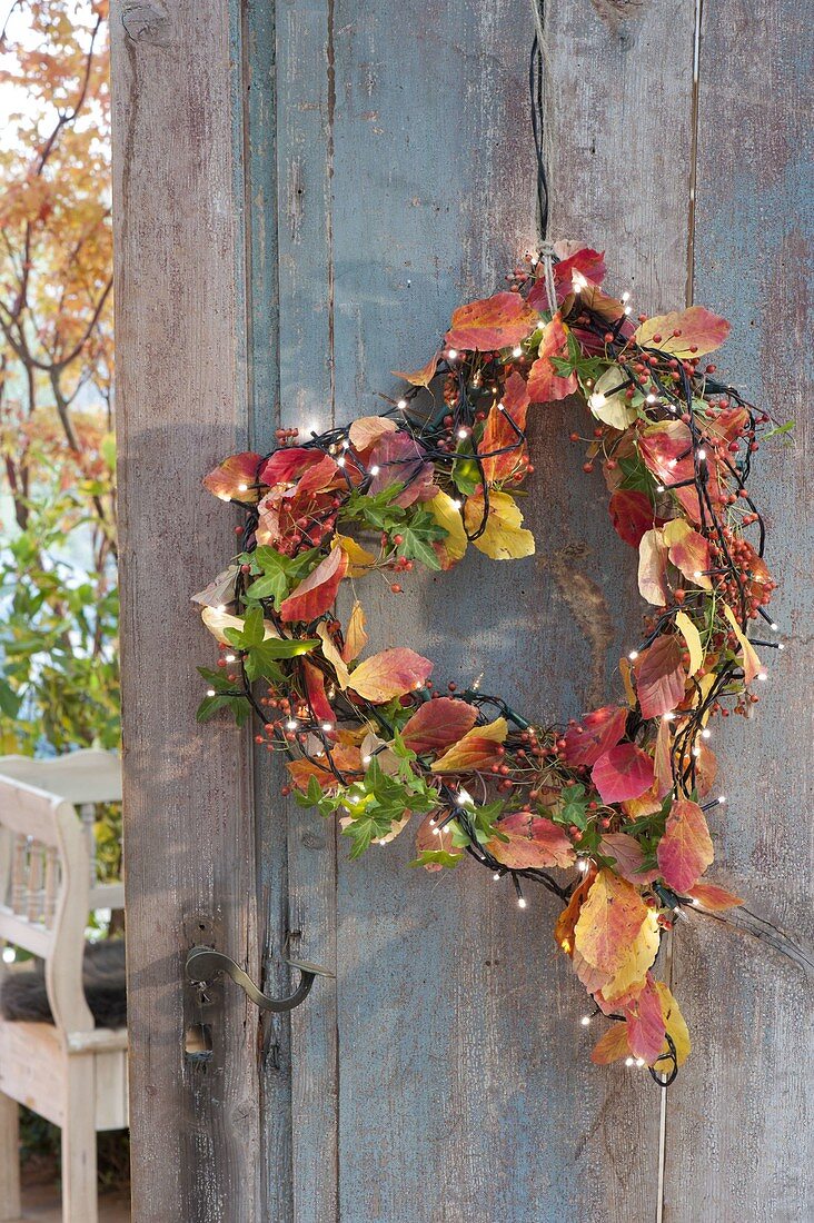 Heart with autumn leaves as a door wreath