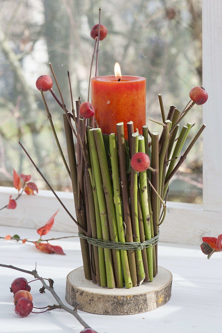 Natural candle deco on the window