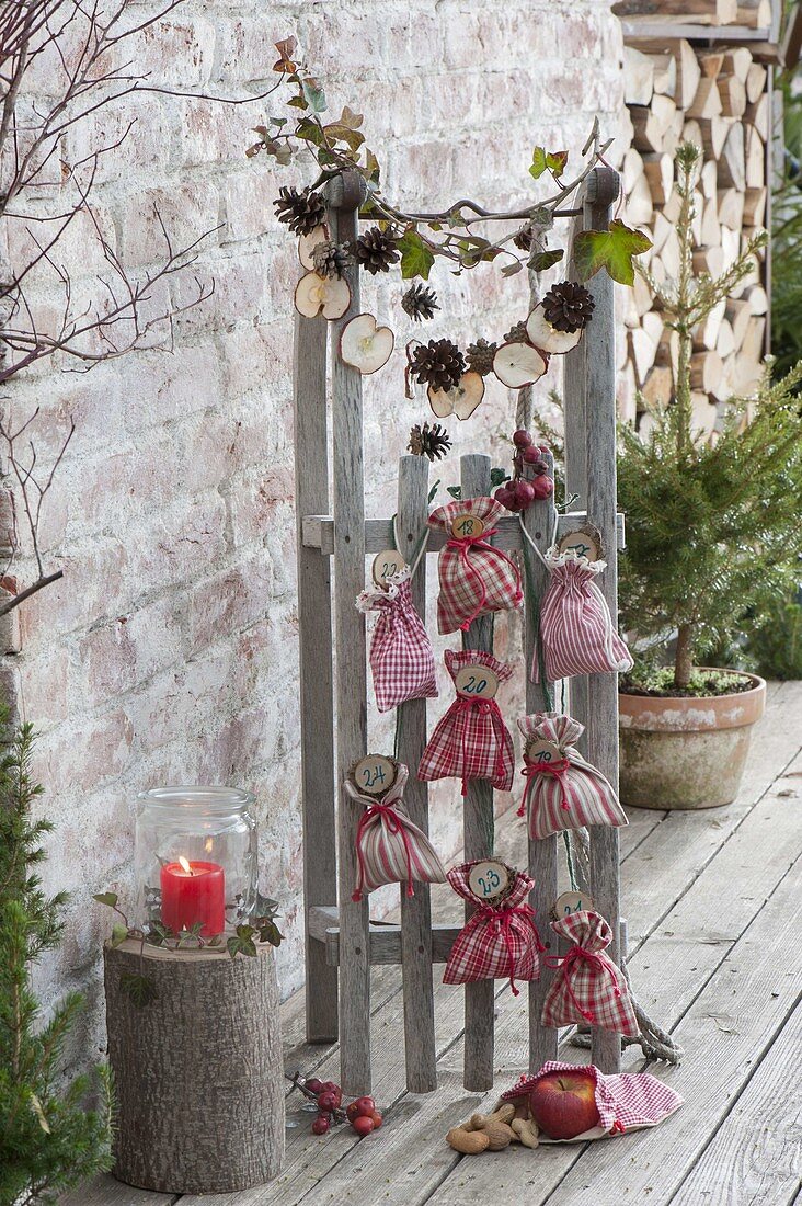 Numbered bags as advent calendars tied to sledges