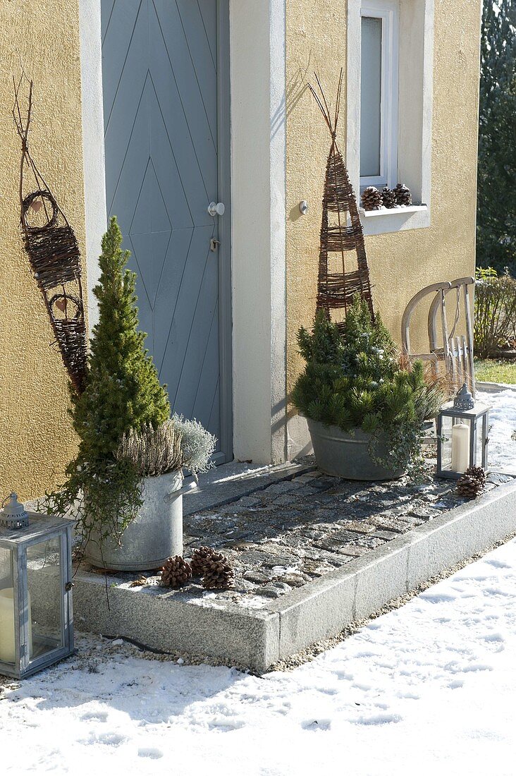 Planted zinc vessels at the house entrance