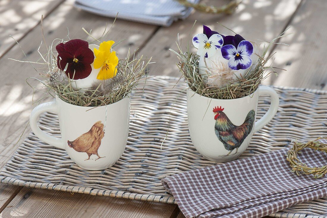 Easter table decoration in cups with chicken decor