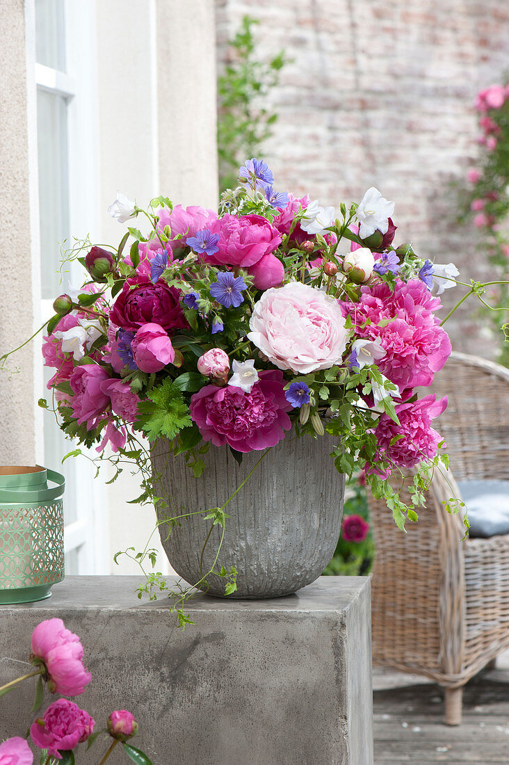 Lush bouquet of Paeonia (peony), geranium