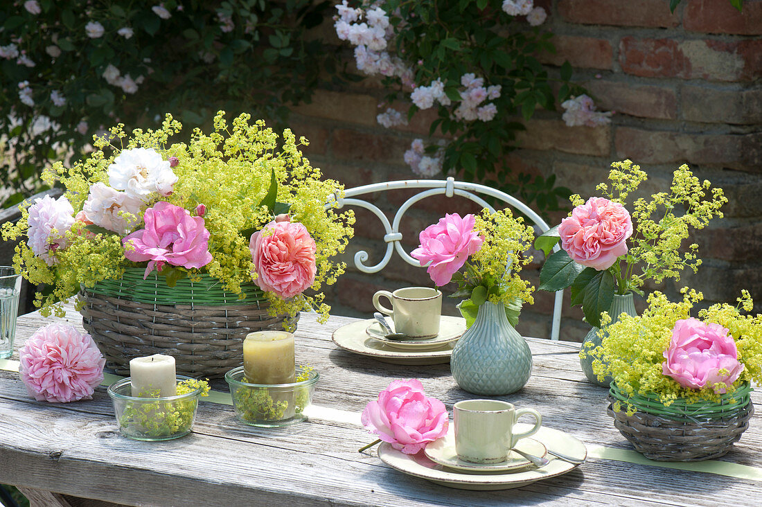 Table decoration with lady's mantle arrangement in the basket