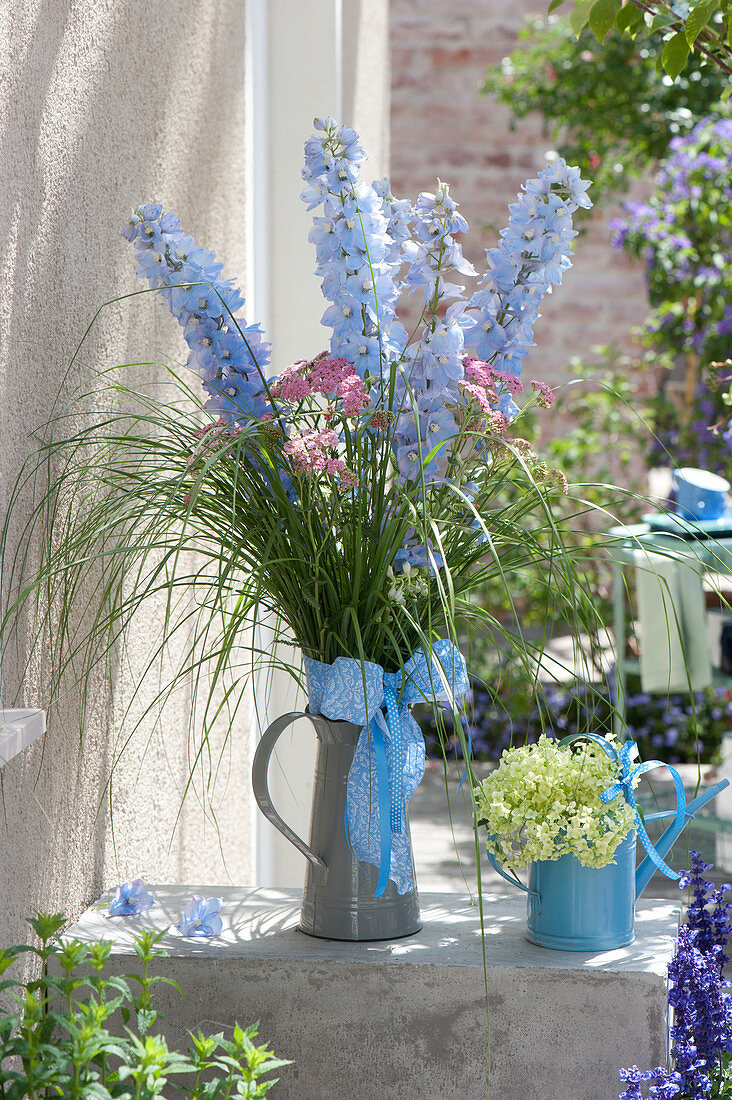 Jug with delphinium, achillea and grasses