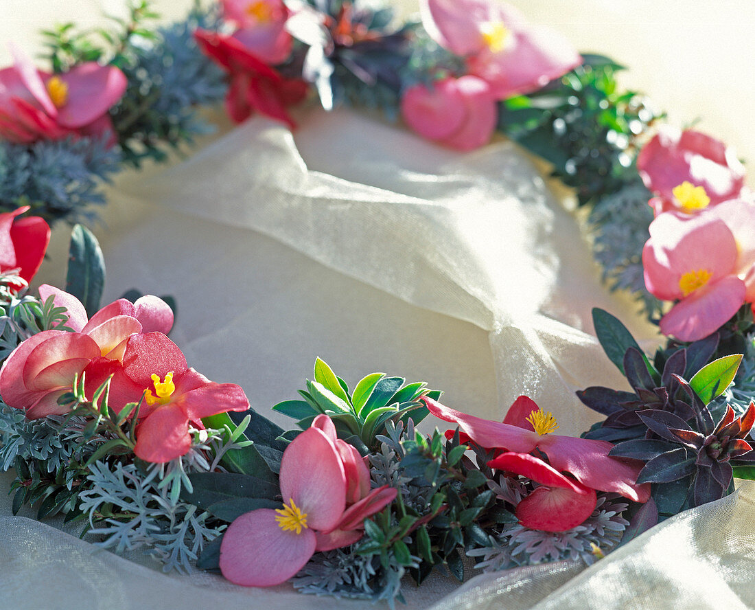 Table wreath of begonia flowers, curry herb, myrtle