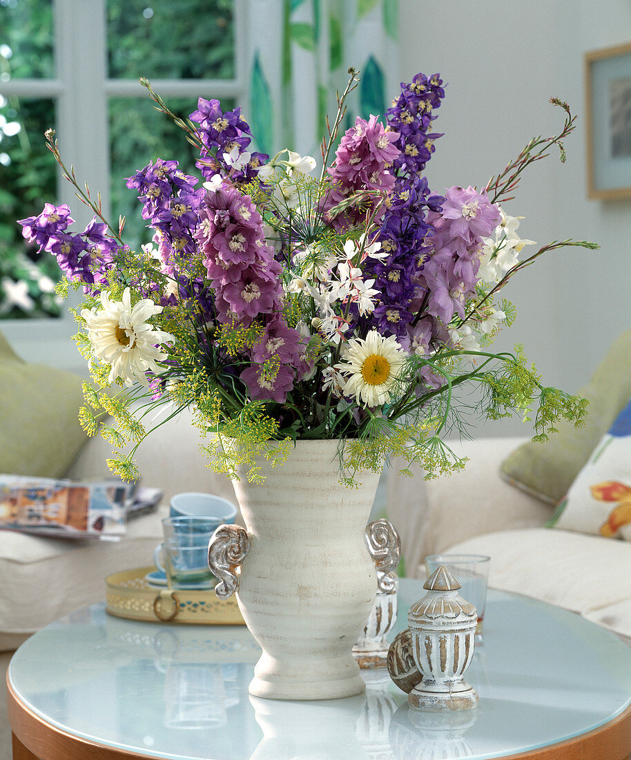 Bouquet of delphinium, daisies, dill and magnificent primrose