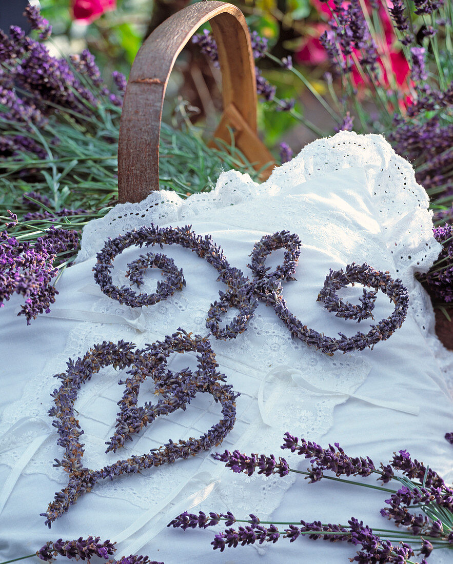 Lavender ornaments on white lace cushion