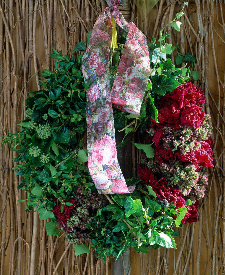 Wreath of hedera (ivy), box, oregano, dried paeonias