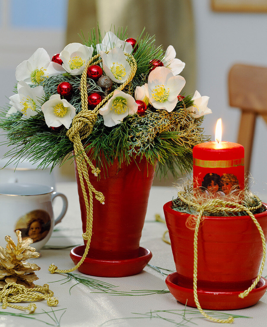 Bouquet of Helleborus niger (Christmas rose), Picea (silk pine), glass balls, Cupressus