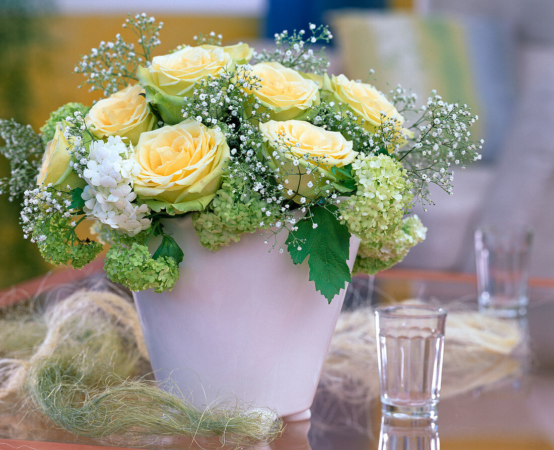 Vanilla coloured rose blossoms, Viburnum (snowball)