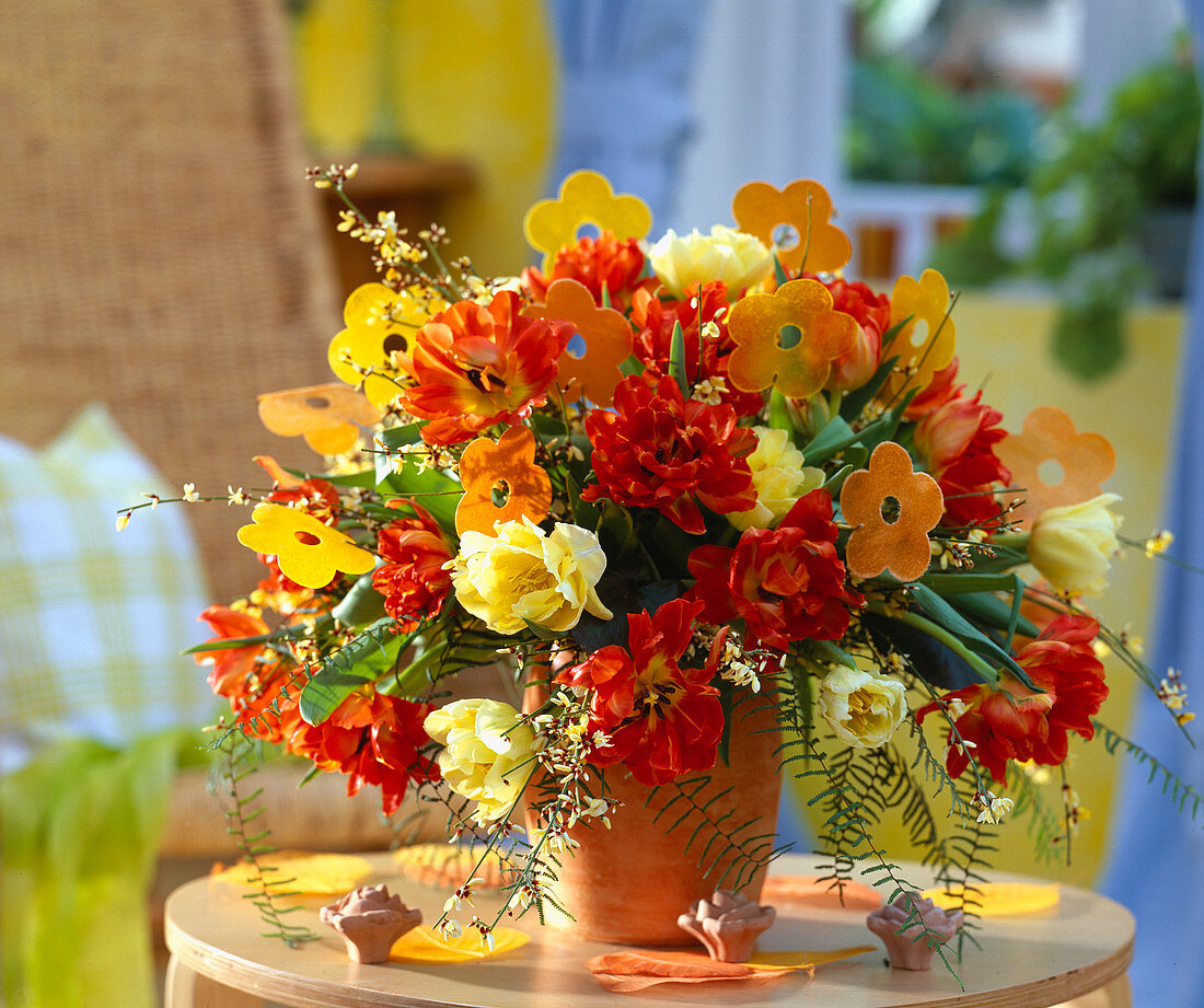 Tulipa 'Willem van Oranje', ' Kareol' (yellow), wax paper flowers, Cytisus (broom)