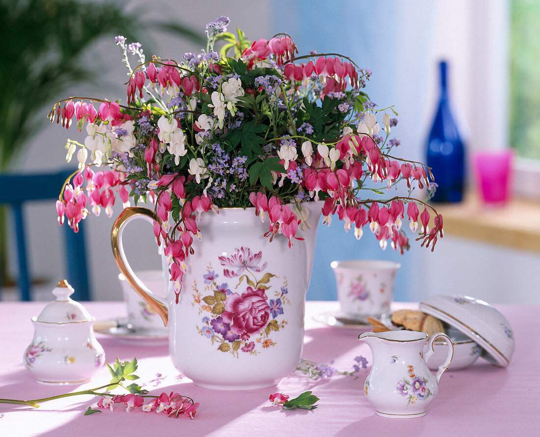 Milk jug with Dicentra (Weeping Heart) with white and pink flowers