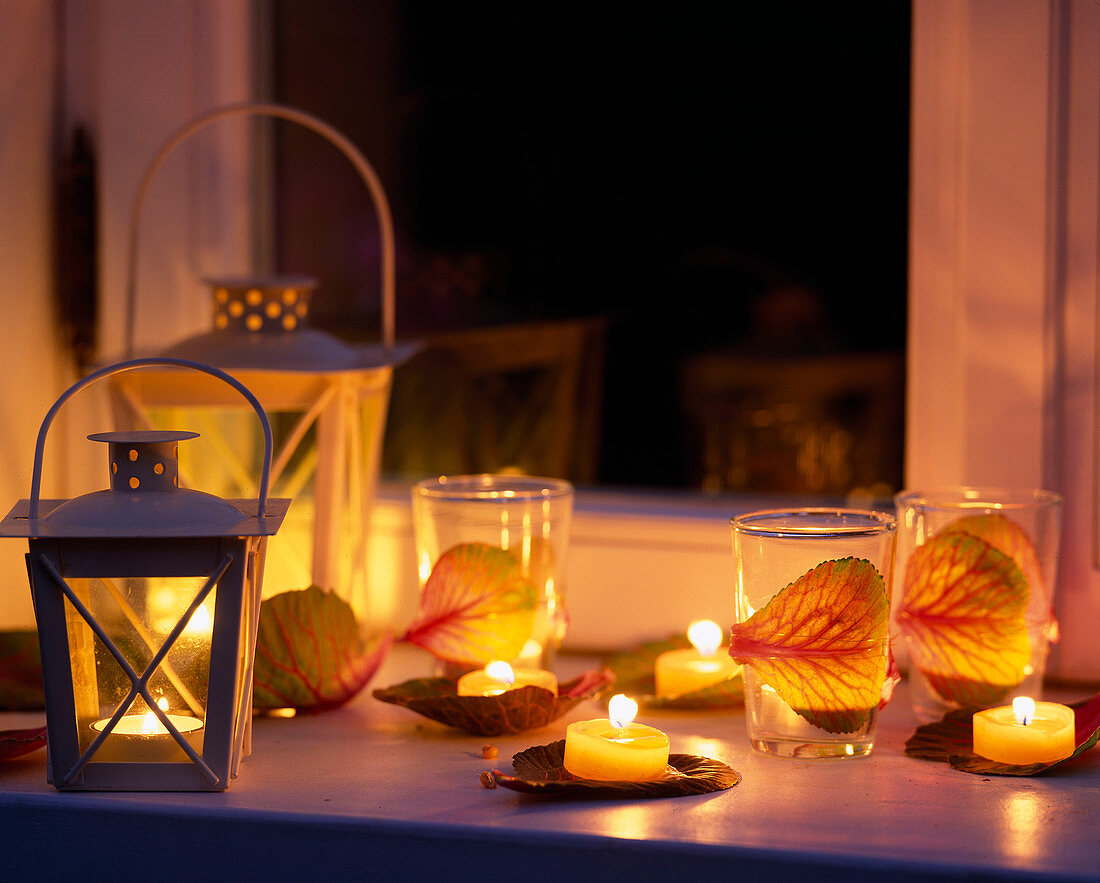 Glasses decorated with leaves of Brassica (ornamental cabbage) as lanterns