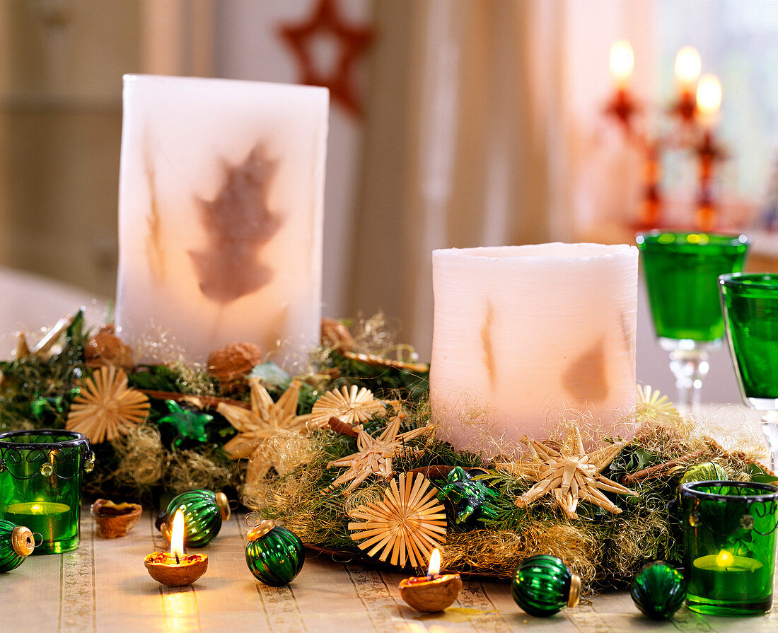 Lanterns cast in wax, Abies (fir), Chamaecyparis (false cypress)