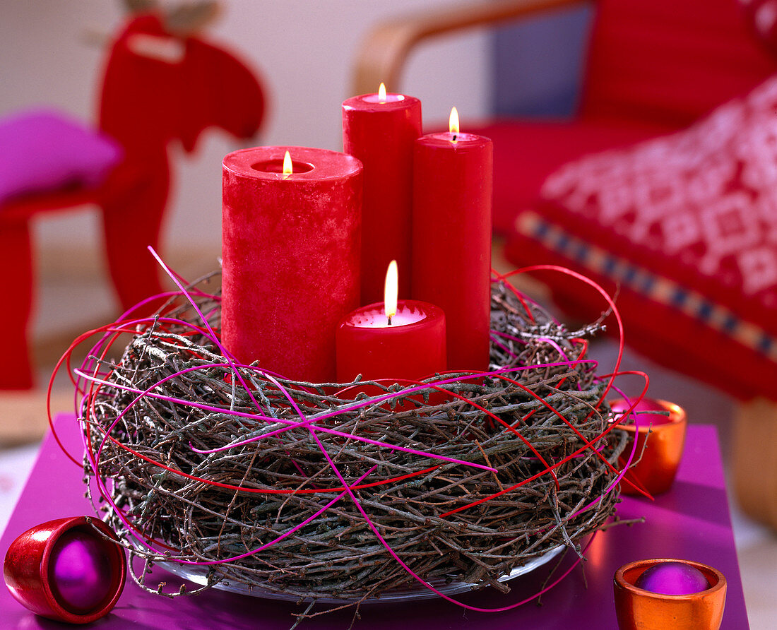 Wreath made of Larix (larch twigs) with red candles and coloured peddig reed