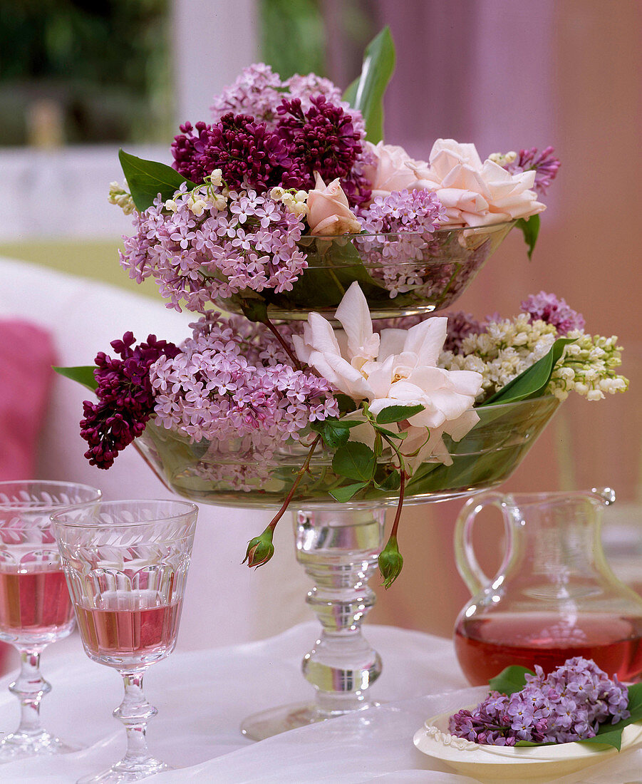 Syringa (lilac), Rose 'New Dawn', Convallaria (lily of the valley) in glass