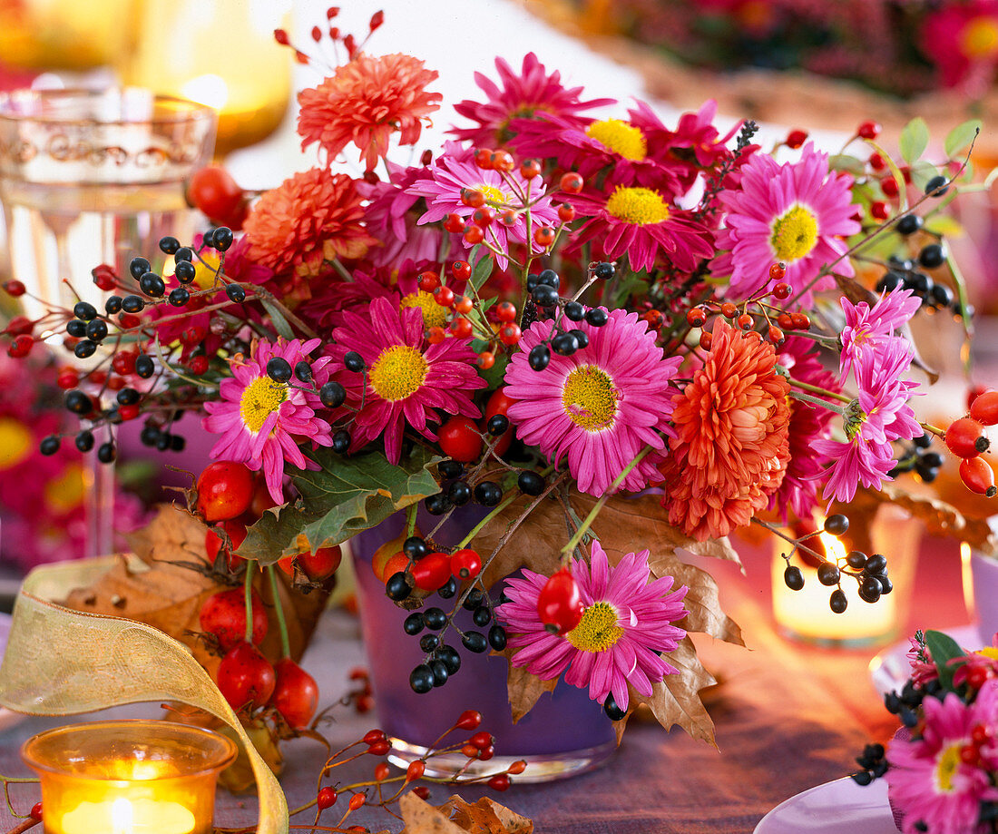 Chrysanthemum, rose Rosehips, Ligustrum Privet berries in Purple Glass Mug