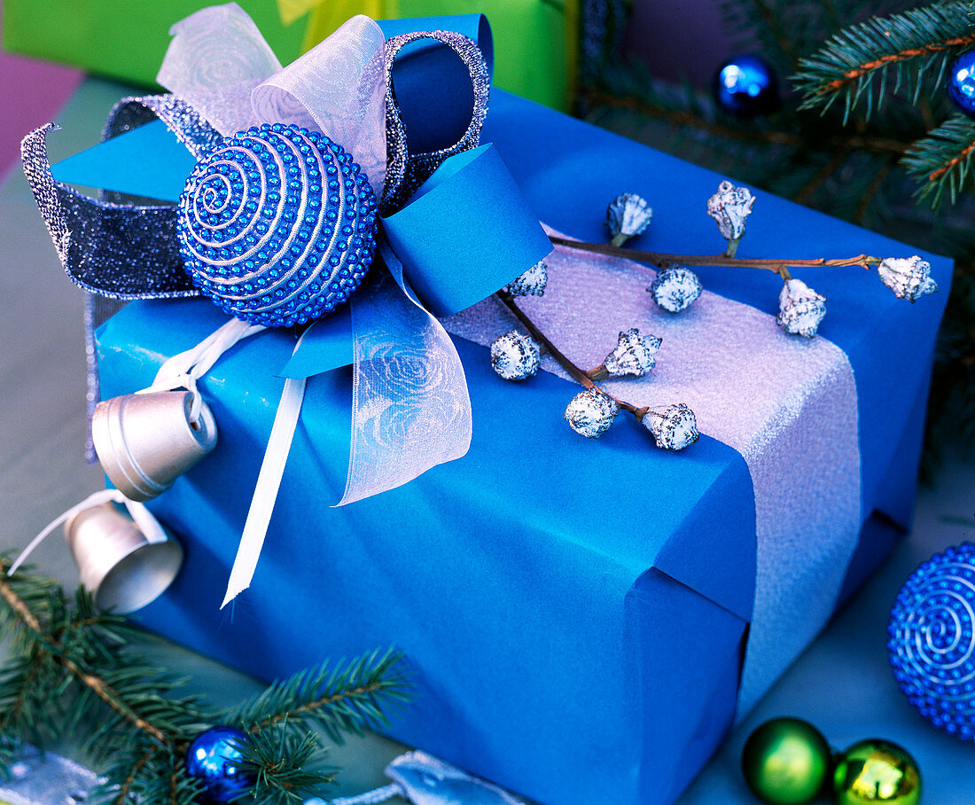 Blue gift with eucalyptus, tree ball, silver pots, ribbon bows