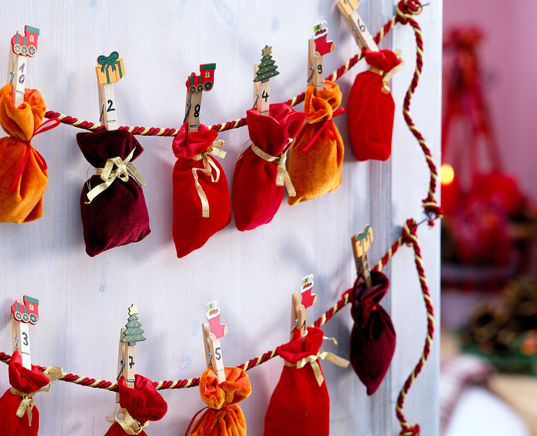 Felt bag with numbered clips attached to string as an advent calendar