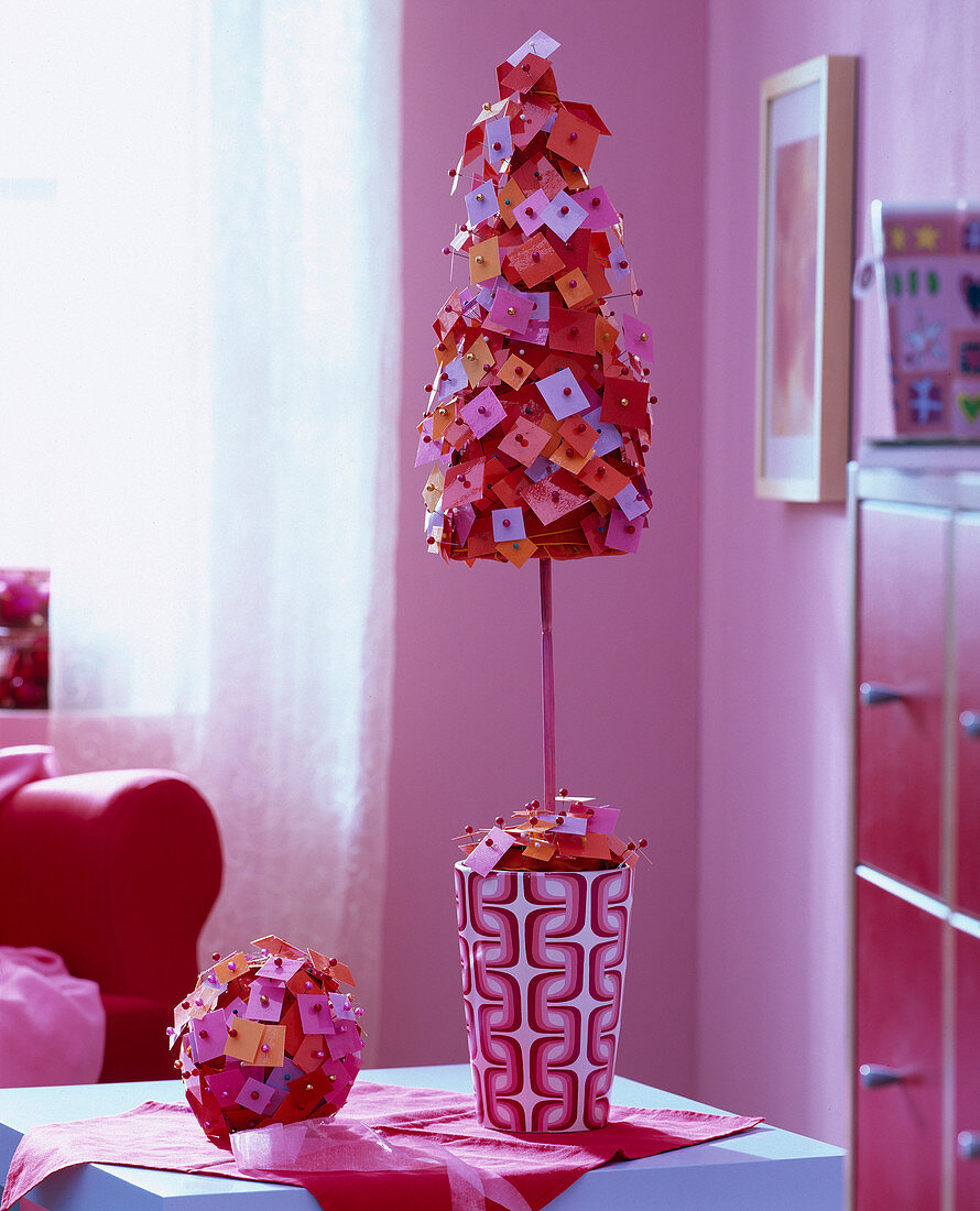 Little tree and ball made of square pieces of paper pinned with decorative pins