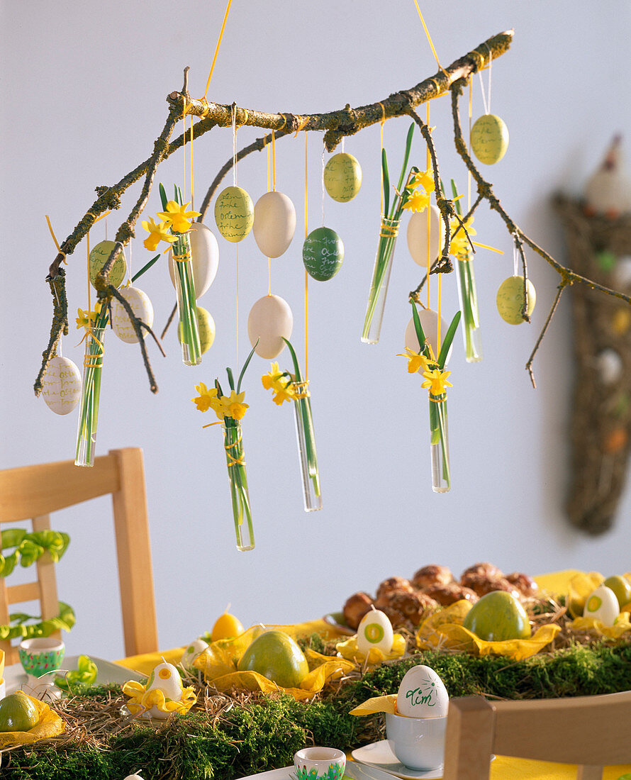 Branch hung from ceiling with Easter eggs