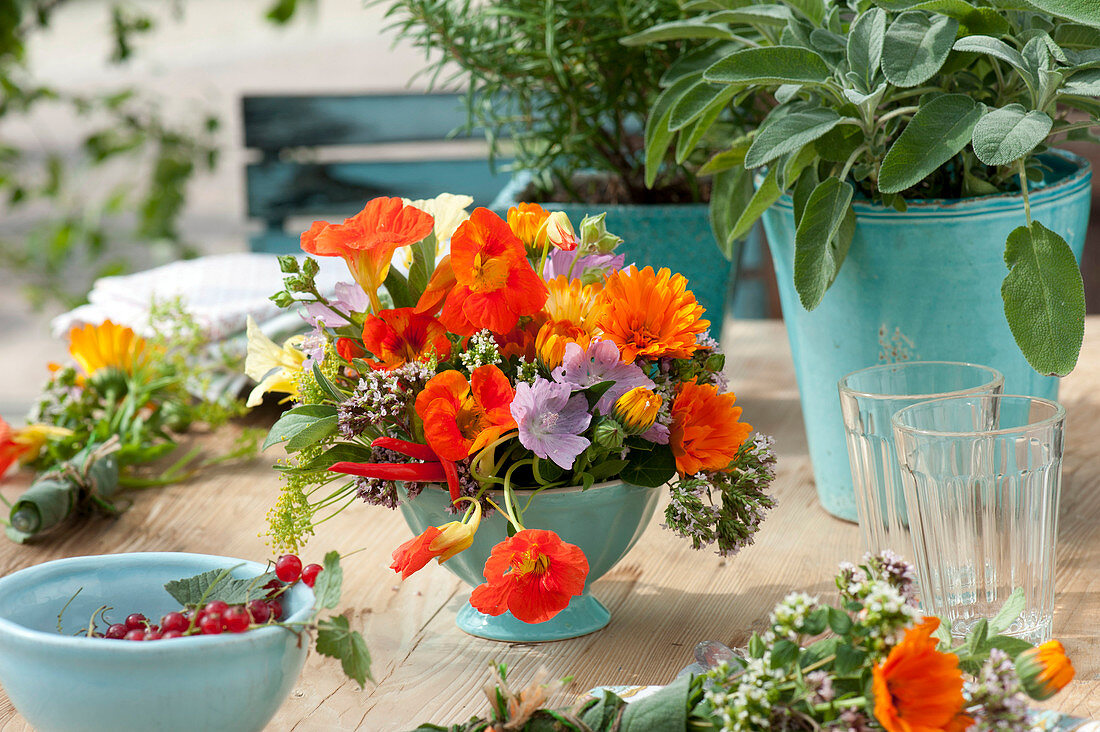 Table decoration with herbs and edible flowers