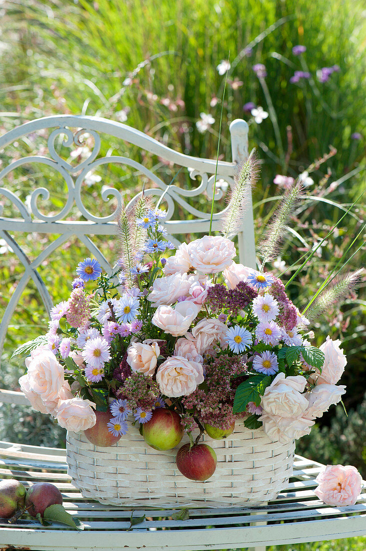 Autumn arrangement of pink (rose), aster (asters), sedum