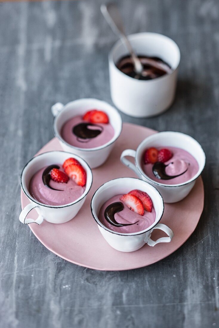 Vegan strawberry and cashew mousse with chocolate sauce