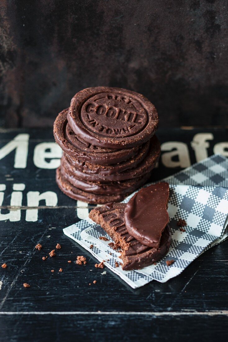 Vegan walnut and chocolate cookies with the words 'Best Cookie in Town' stamped on them