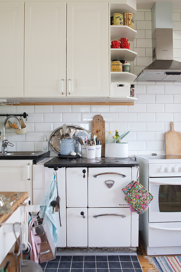 White, vintage-style country-house kitchen