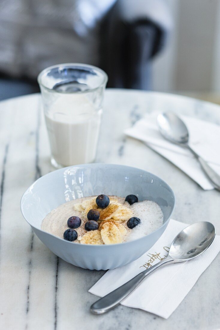 Vegan buckwheat nut porridge with bananas and blueberries