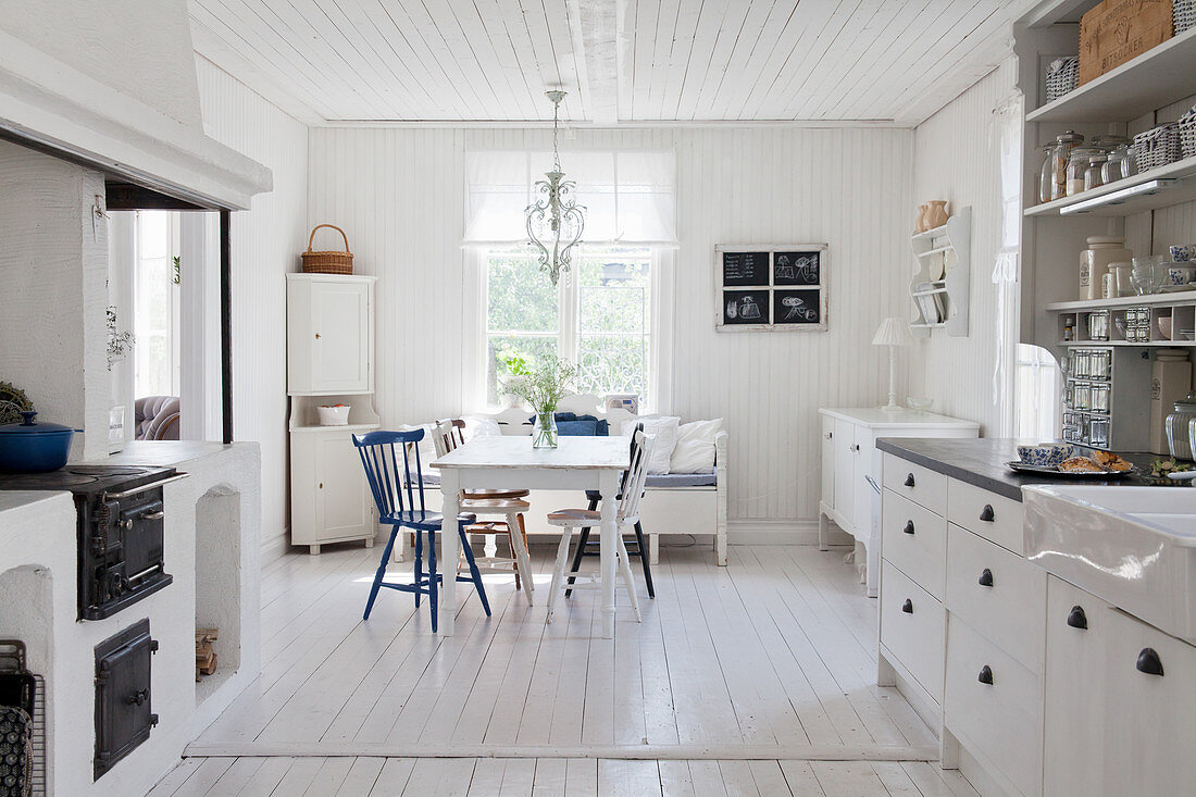 Dining table in open-plan, Scandinavian, country-house kitchen