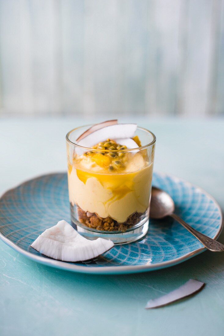 Mango and coconut cheesecake with passion fruit in a glass