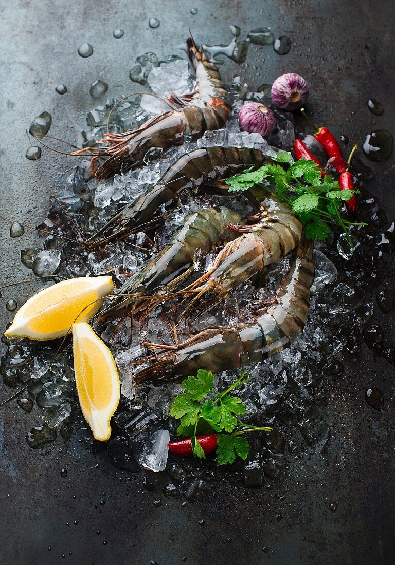 Fresh prawns on ice with lemon