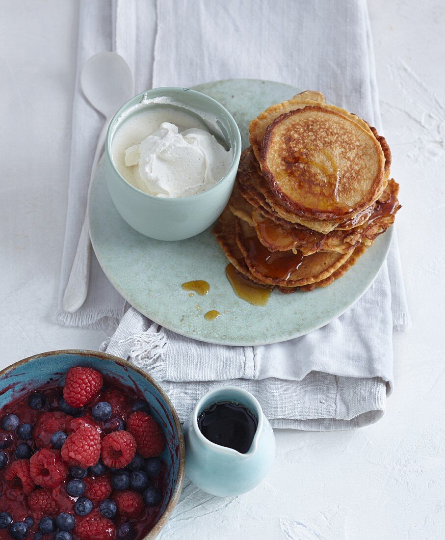 Fluffy kefir pancakes with fresh berries and ricotta cream