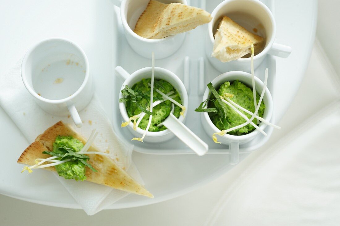 Pita corners with pea dip and crispy sprouts