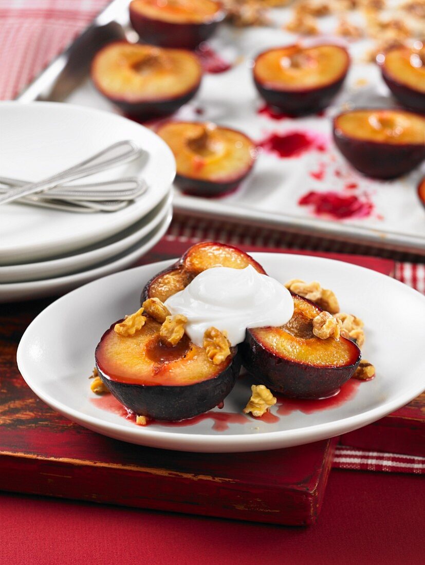 Roasted plums with honey, walnuts and yoghurt