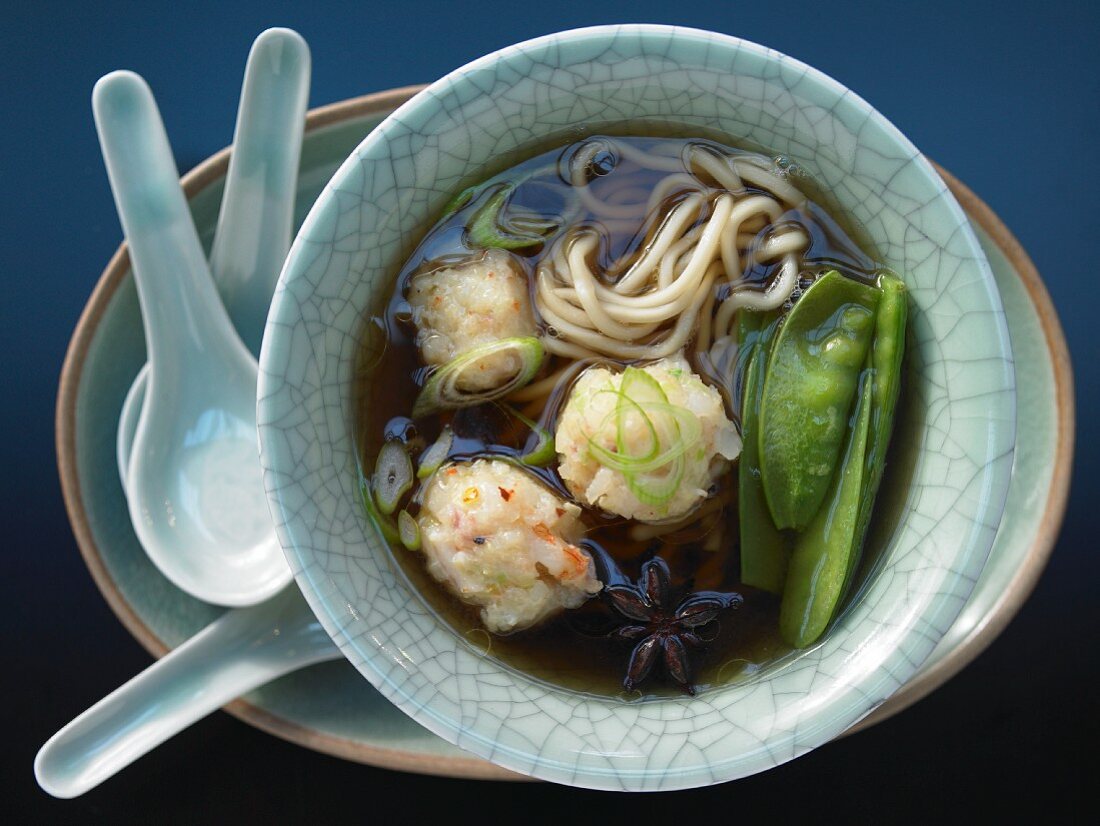 Shrimp ball soup with snow peas and mie noodles