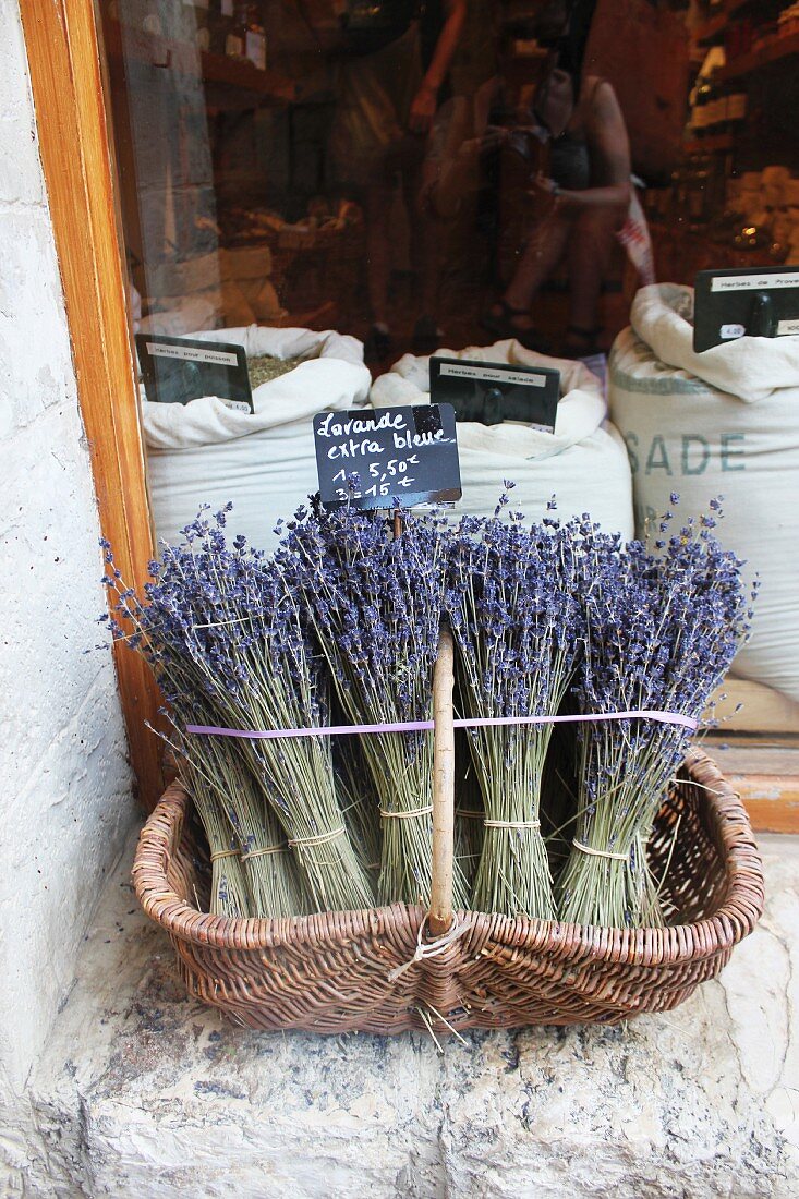 Lavender in a basket in front of a shop window