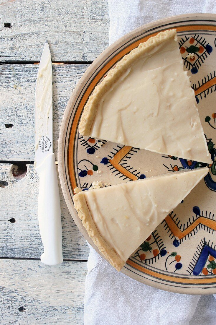 Vanilla cream tart on a patterned plate