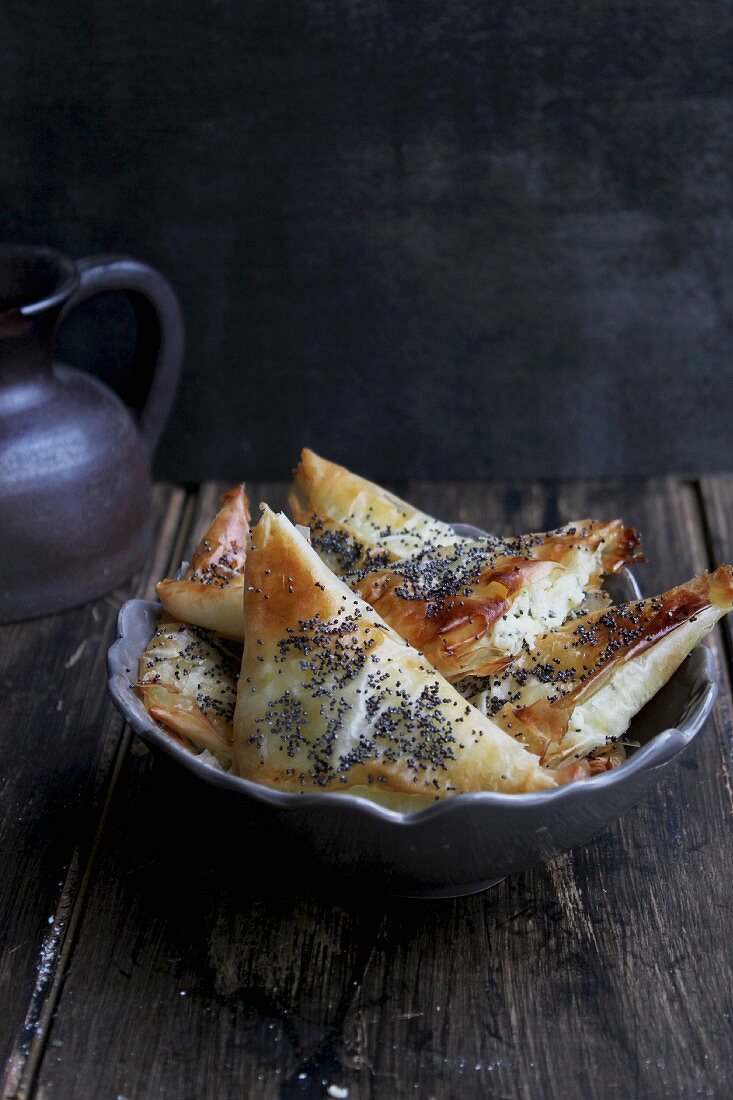 Puff pastries filled with cheese and poppy seed