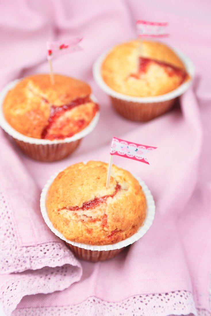 Jam-filled muffins decorated with little flags