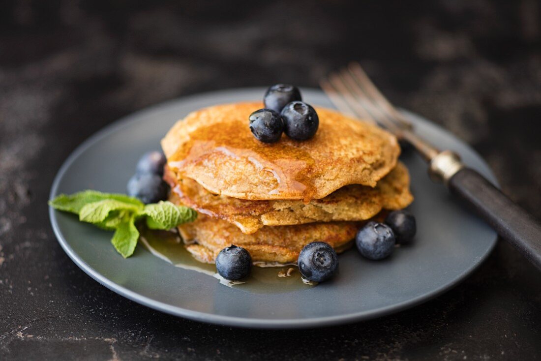 Gluten-free lupin pancakes with maple syrup and blueberries
